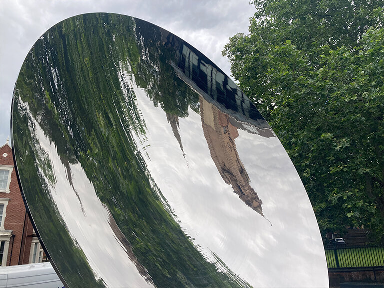 A reflection of Nottingham Playhouse's tower in a concave mirror